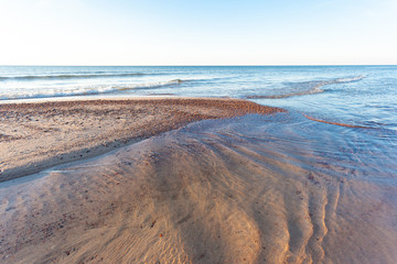 beautiful golden sunset over the sea and the small lagoon