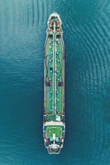 Oil Ship tanker park on the sea waiting transfer to oil refinery for transportation or energy concept background.