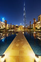 Poster Beautiful view of Dubai, UAE. Illuminated arab houses at night © Ivan Kurmyshov