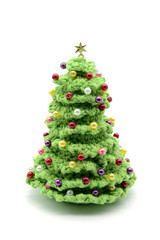 crochet christmas tree with pearls on white isolated background