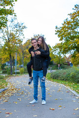 Young couple in love walking in the autumn park