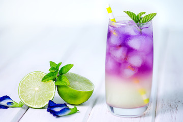 Butterfly pea flower drink with lime , honey and mint leaf , a fresh herbal healthy detox drink