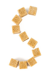brown sugar cubes arranged as S letter