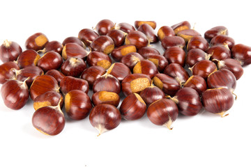 Fresh chestnuts with peeled roasted chestnut isolated on white background. Hippocastanum isolated.