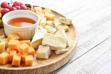 Cheese plate - various types of cheeses with honey