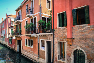 Fototapeta na wymiar Beautiful street with beautiful houses in Venice Italy
