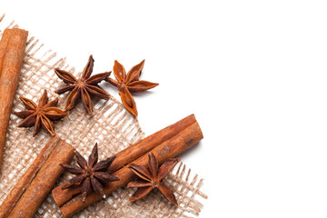 Obraz na płótnie Canvas Cinnamon sticks and star anise isolated on white background