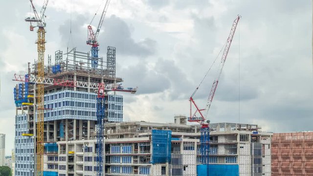 Construction site of a modern skyscraper in Singapore timelapse