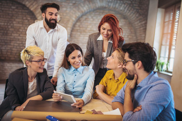 Group business people meeting to discuss ideas in modern office. Woman holding digital tablet