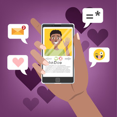 Hand holding mobile phone with male person on the screen