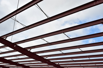 Steel roof beams of new commercial building under construction.