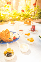 Turkish tea, Cheese, Honey, Jam,  Olives, Simit. Authentic turkish breakfast. Local cuisine concept