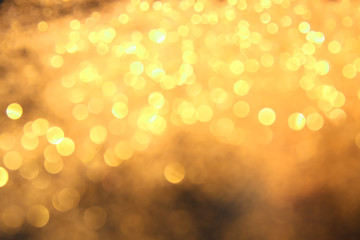 Blurred view of golden glitters