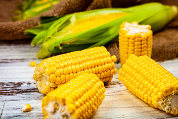 Ripe corn on a wooden table