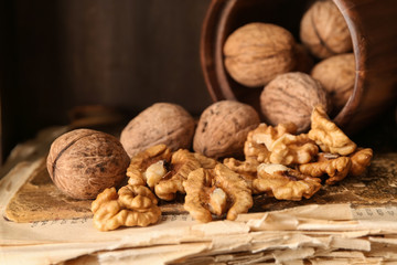 Tasty walnuts on old book, closeup