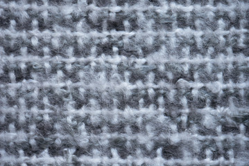 Gray woolen knitwear fabric texture.