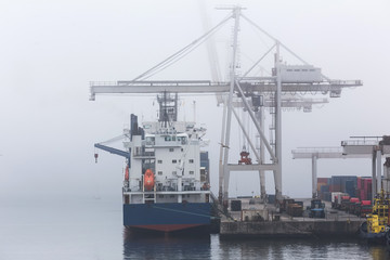 Fototapeta na wymiar an container port in fog background