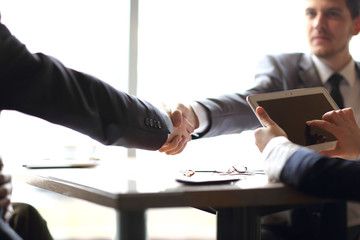 close up.confident handshake of business people in the office