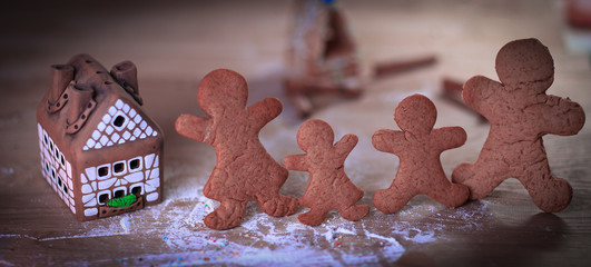 candles and gingerbread men at the Christmas table