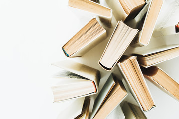 Books on white background. Flat lay, top view minimal concept.