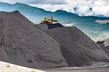 Coal: Moving a pile of coal with a D8 Cat © lexfosse