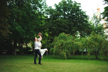 Fototapeta premium Romantic wedding moment, couple of newlyweds smiling portrait, bride and groom hug.