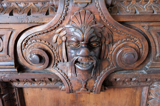 Carving of face on door frame