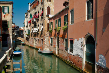 Fototapeta na wymiar View of houses and canal street with bridge in the old town Venice Italy