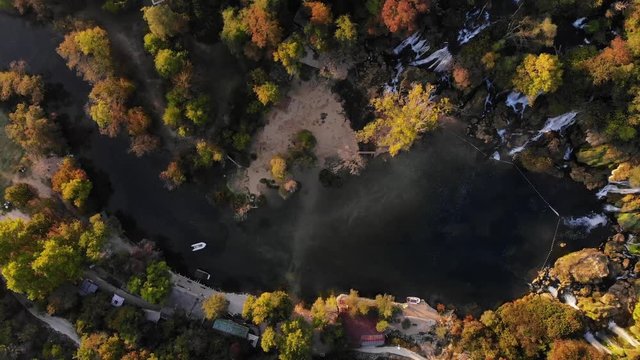 Aerial drone fly over Kravica waterfall in Bosnia at autumn season.