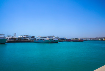 Fototapeta na wymiar Red Sea, yachts and boats in the port of Egypt. Hurghada and Cairo Asia. Stock photo for design
