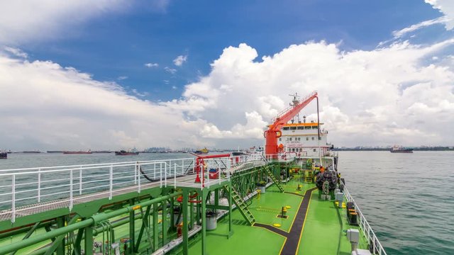 Green deck of the tanker under blue sky timelapse
