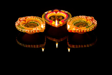 Diwali celebration diya oil lamps lit  happy diwali