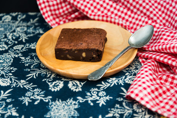 Chocolate Brownie cake on a dark plate