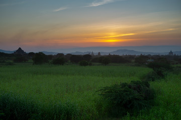 Obraz na płótnie Canvas Sunset landscape with pagodas