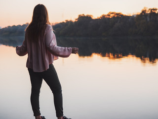 Girl at sunset as if walking on water