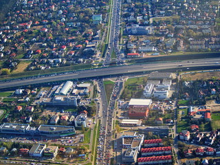 Aerial cityscape higway and vehicles between buildings
