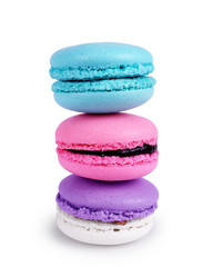 Colorful macarons cakes. Sweet french macaroons flying in motion on a white background