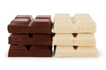Slices of black and white chocolate on a white background