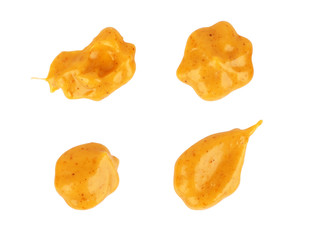 Set of curry sauce drops on a white background