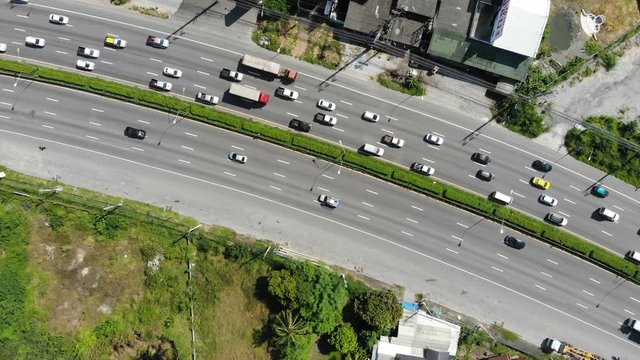 Aerial view of vehicle on highway in city from drone.