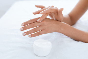 Woman Hand With Cream. Closeup Of Applying Hand Lotion On Hands