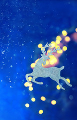 Obraz na płótnie Canvas Christmas toy deer on abstract blue background. new year and Christmas holiday season. winter festive concept. template for design