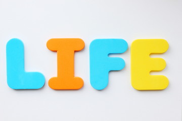 word "money, life" of letters on a colored background, soncept