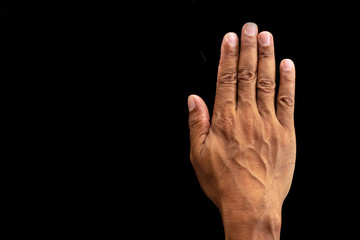 Hand on a black background