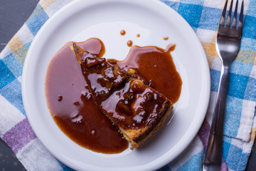 close up of apple pie slice with caramel cinnamon
