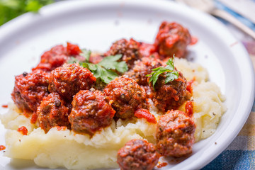 Tasty details of tomato meatballs with mash