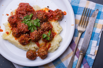 Tasty details of tomato meatballs with mash