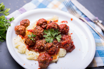 Tasty details of tomato meatballs with mash