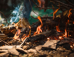 Fire on ground. Couple on nature