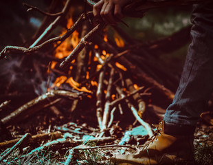 Bonfire burns in the forest. Camping